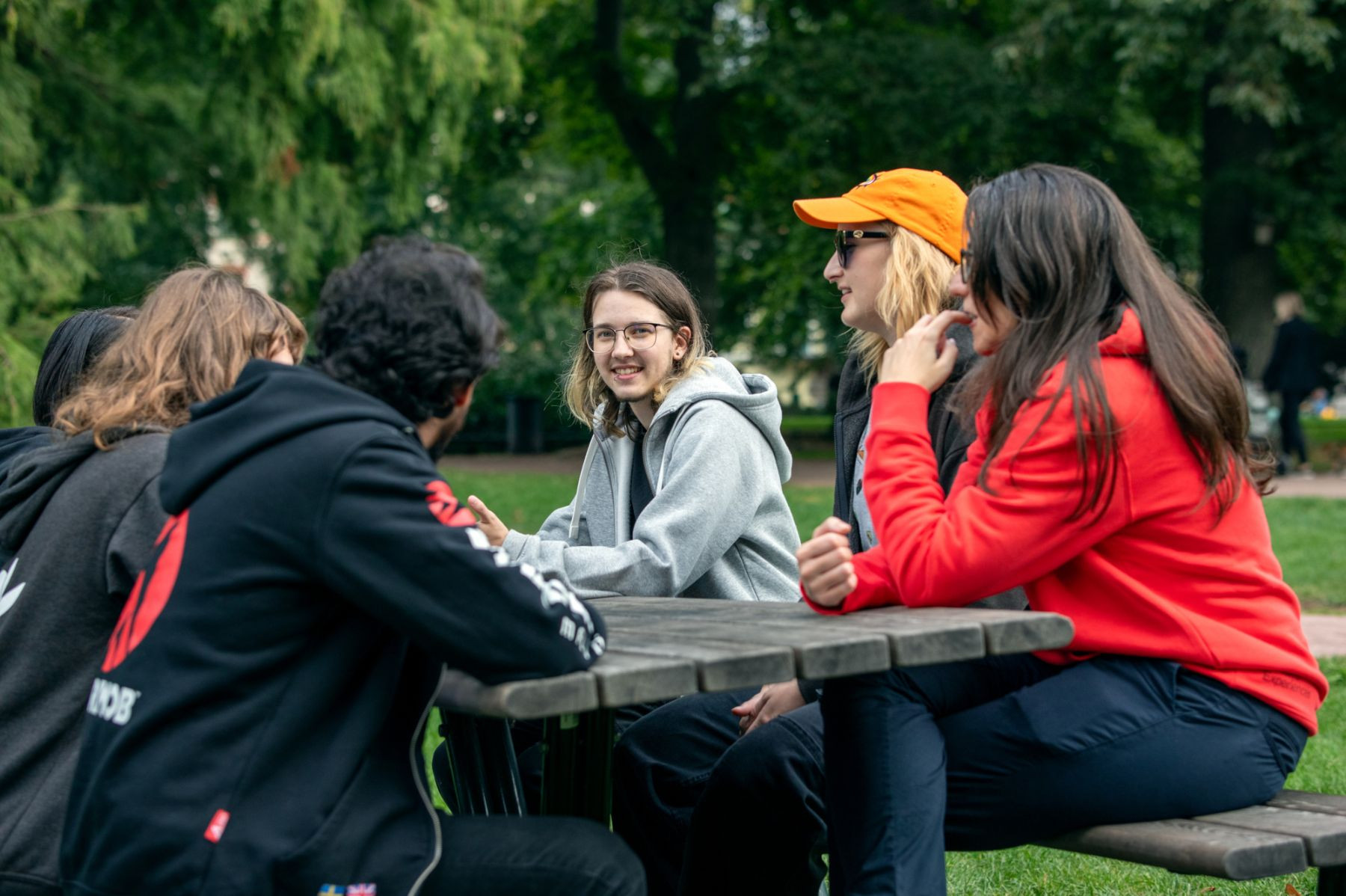 Game developers sitting at a bench in the park