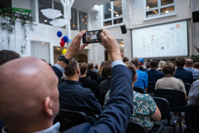 Person photographing at an event