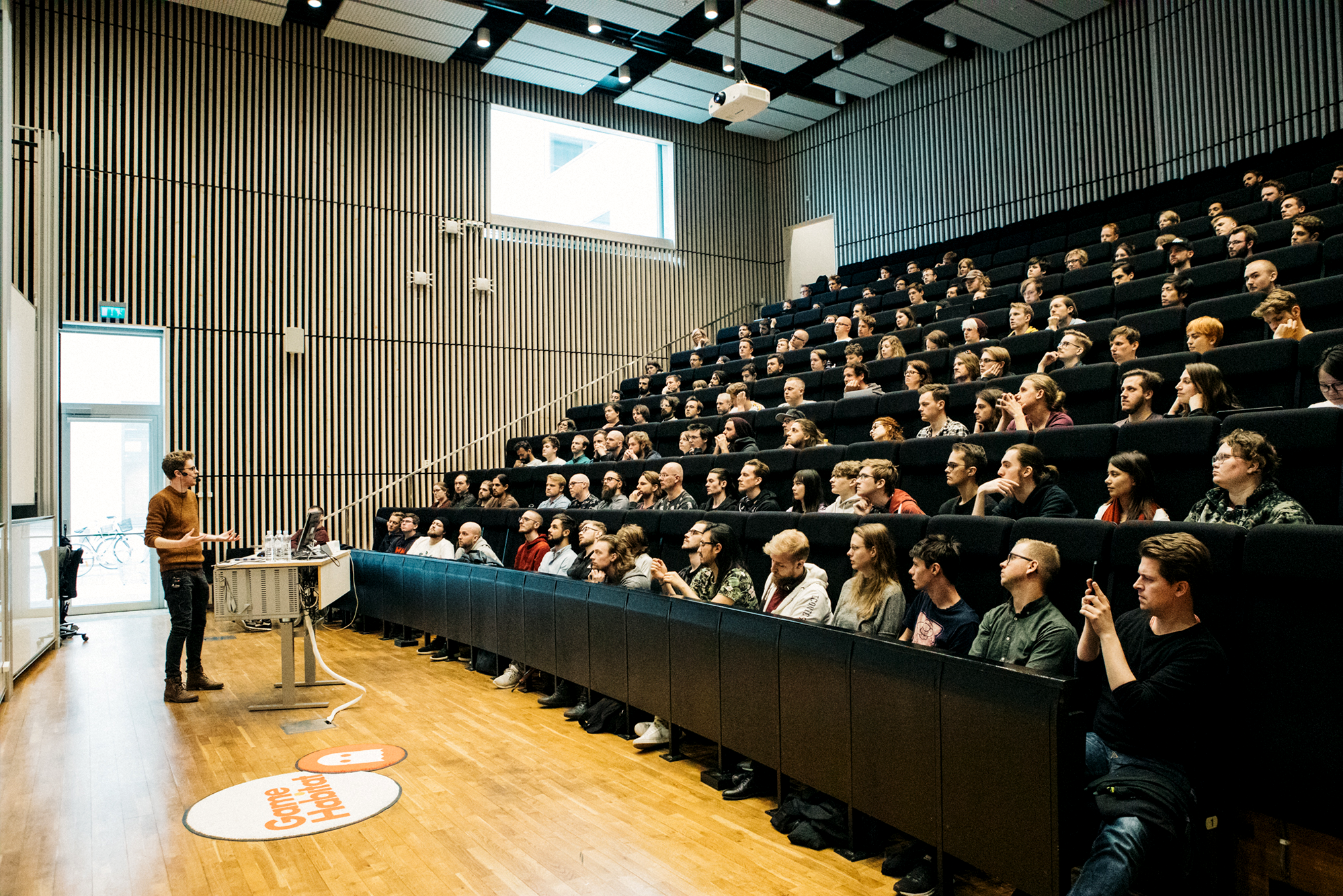 Person giving a talk in auditorium