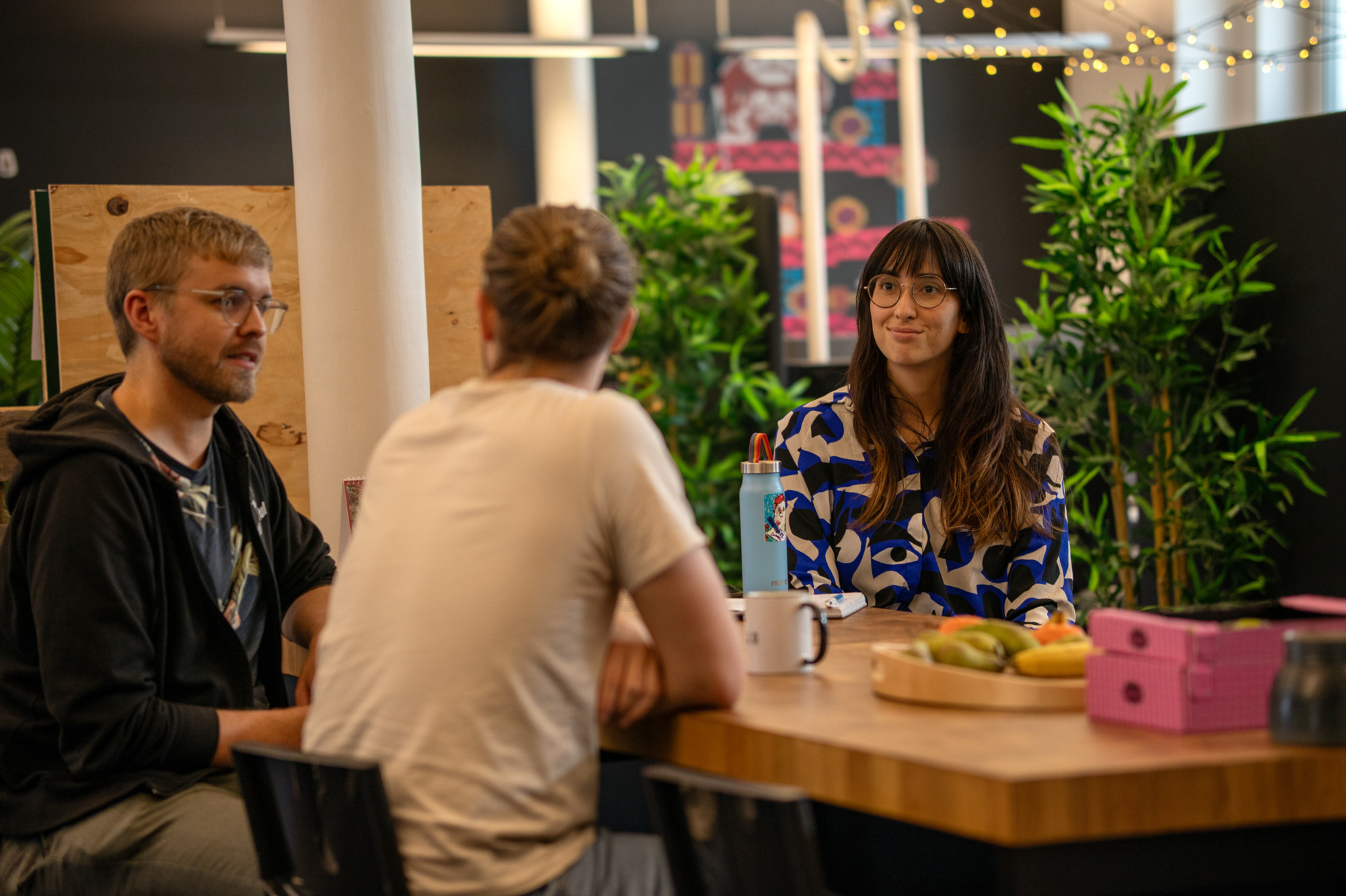 Game developers talking in their office