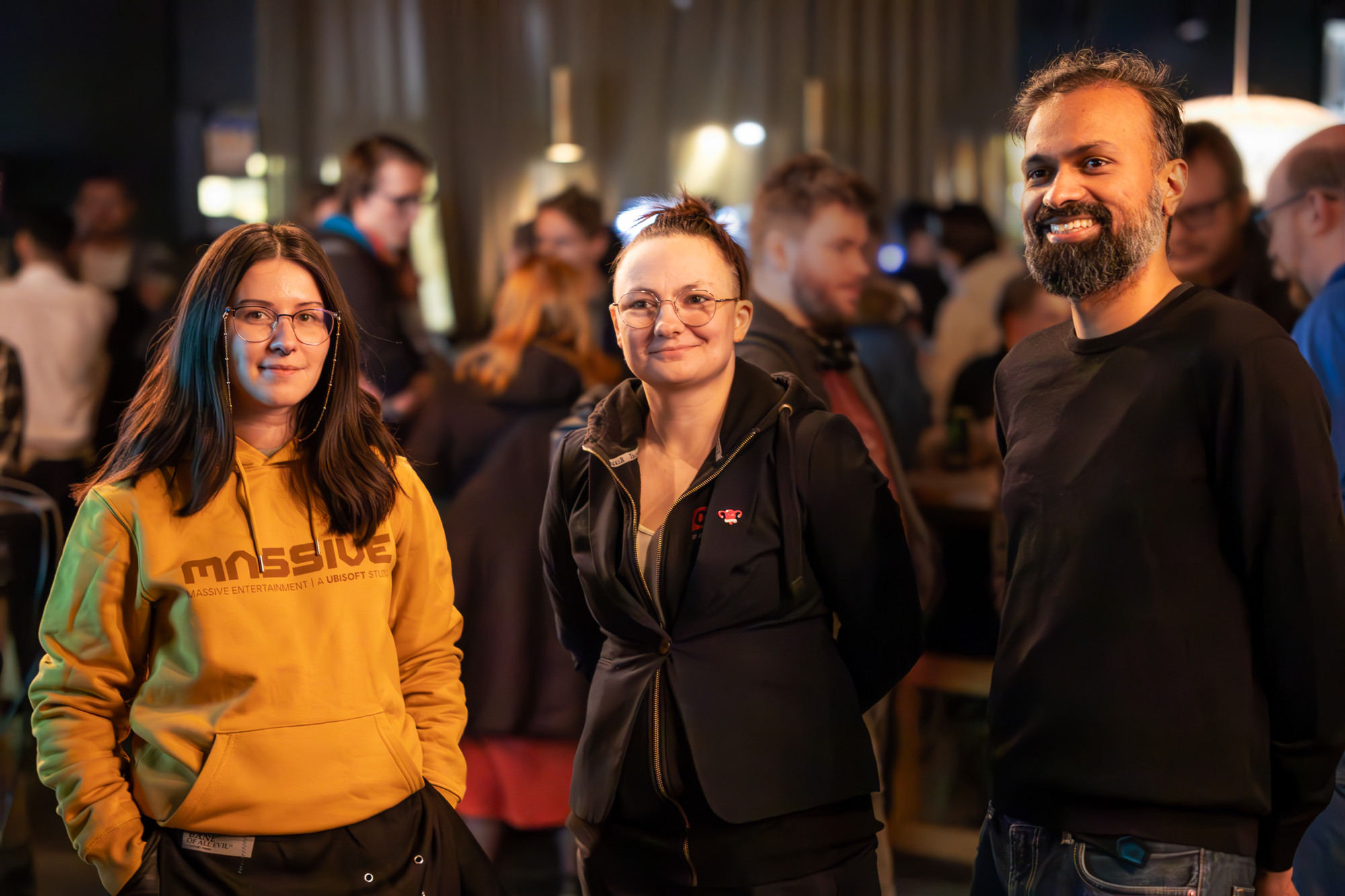 Three game developers at a meetup