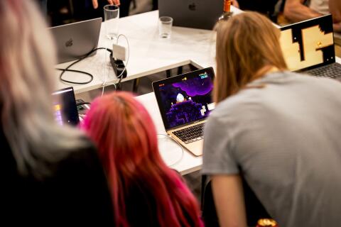 Game developers testing a game